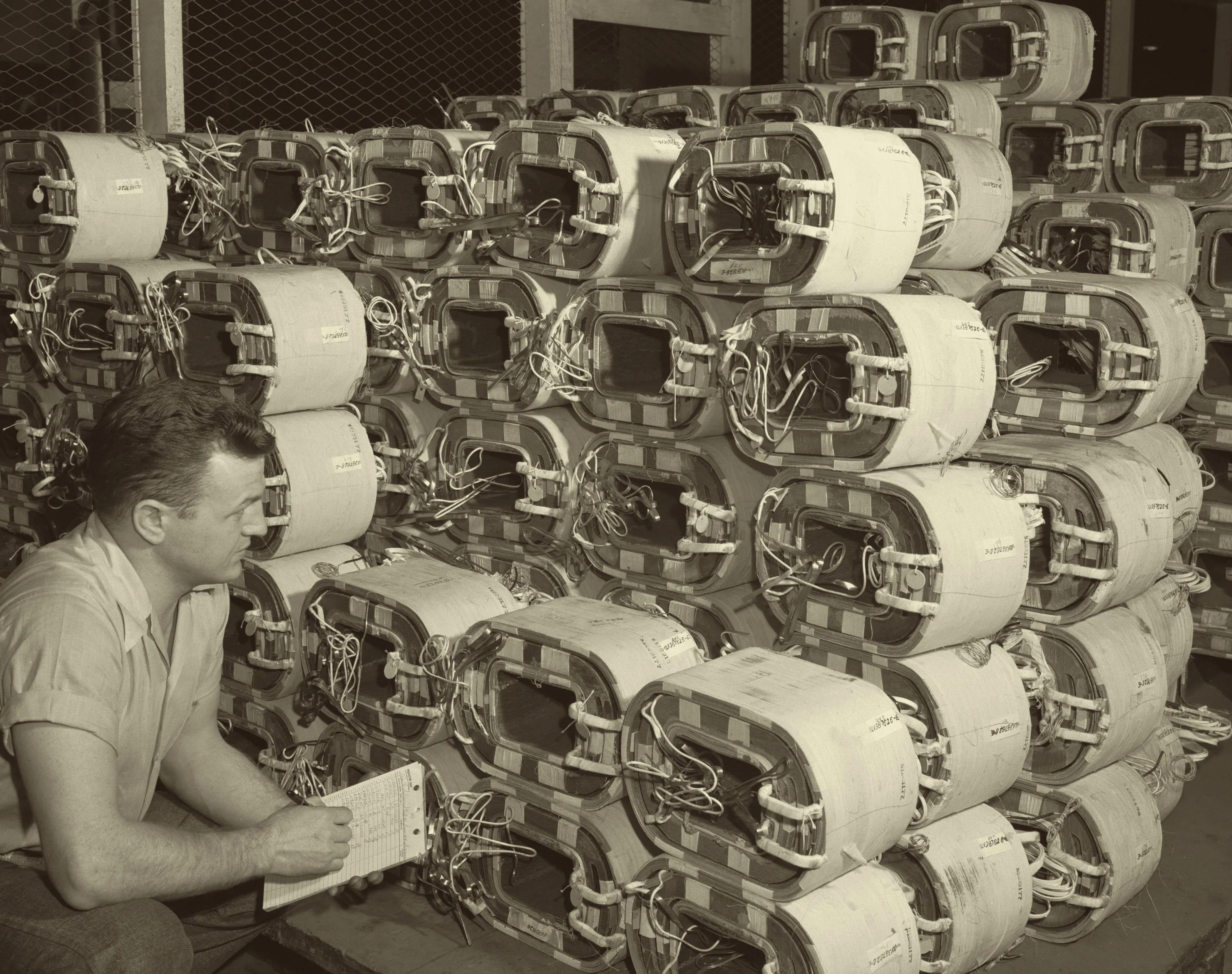 Checking stock of distribution transformer coils, Westinghouse plant, Sharon, Pennsylvania, 1942